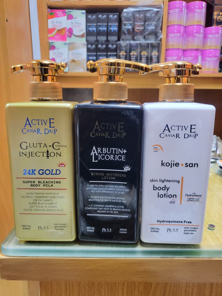 Happy Nigerian beauty store owner with bulk skincare stock